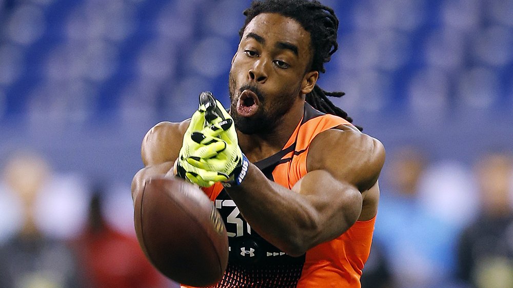 Connecticut wide receiver Geremy Davis drops a pass at the NFL football scouting combine in Indianapolis, Saturday, Feb. 21, 2015. (AP Photo/Julio Cortez)