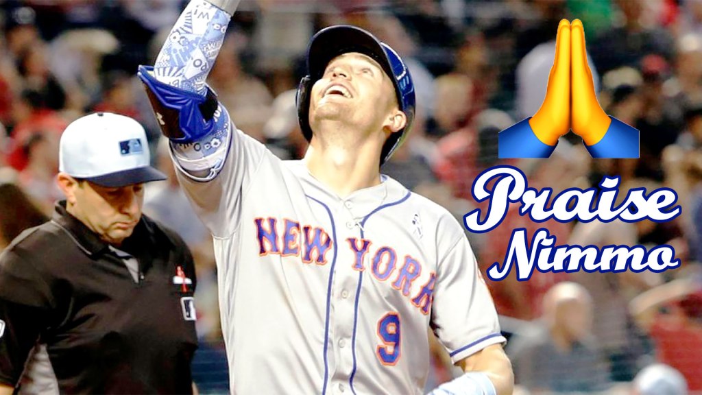New York Mets outfielder Brandon Nimmo points to the heavens after scoring a run.